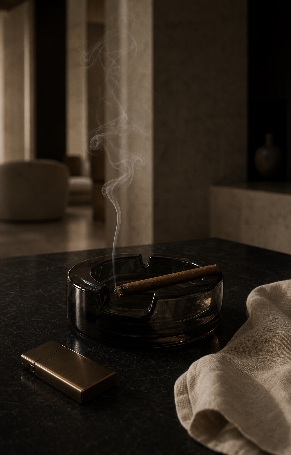 A burning cannabis blunt resting in a smoked-glass ashtray